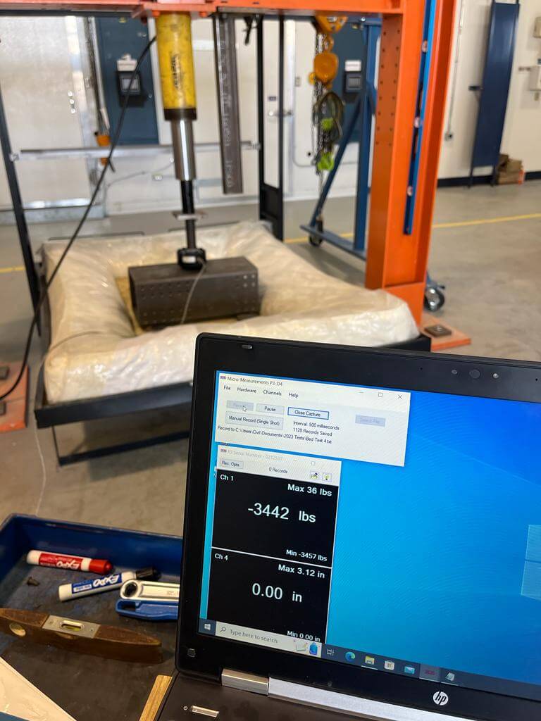 Premium Canadian Murphy Bed tested for strength using a hydraulic press.